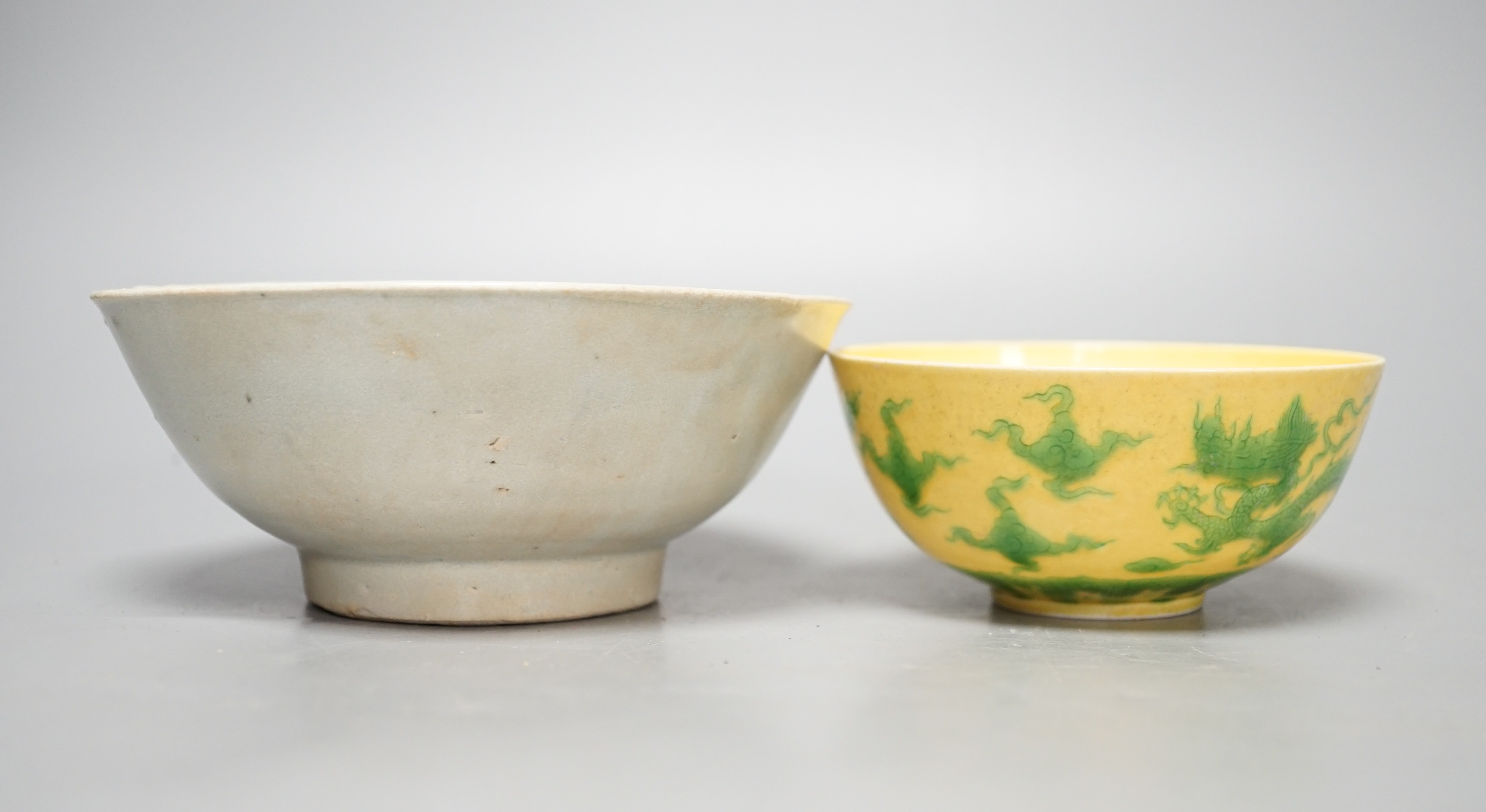A Chinese Teksing cargo bowl c1820 and a yellow ground 'dragon' bowl. Largest 16cm diameter.